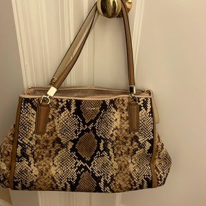 Coach pocketbook gently used.   Great condition  snakeskin pattern. Lots of room